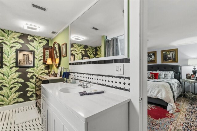 8407 Interbay Blvd, Tampa, FL 33616 - bathroom with wallpapered walls, vanity, ensuite bath, and tile patterned flooring