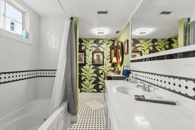 8407 Interbay Blvd, Tampa, FL 33616 - full bath featuring wallpapered walls, vanity, and a combined bath / shower with jetted tub