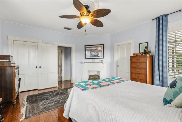 8407 Interbay Blvd, Tampa, FL 33616 - bedroom with a closet, hardwood / wood-style floors, ceiling fan, and a fireplace