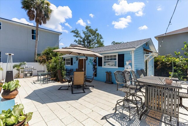 8407 Interbay Blvd, Tampa, FL 33616 - view of patio with outdoor dining space, grilling area, and an outdoor structure