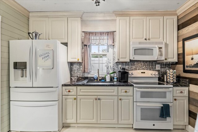 8407 Interbay Blvd, Tampa, FL 33616 - kitchen with white appliances, tasteful backsplash, dark stone counters, ornamental molding, and wood walls