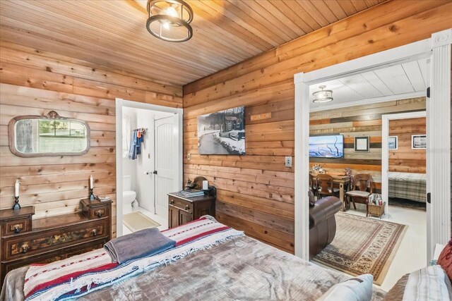 8407 Interbay Blvd, Tampa, FL 33616 - bedroom featuring wood walls, wooden ceiling, and connected bathroom