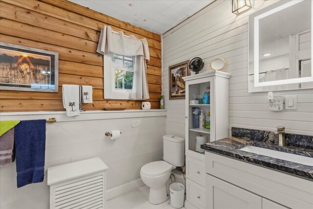 8407 Interbay Blvd, Tampa, FL 33616 - full bathroom featuring wood walls and vanity