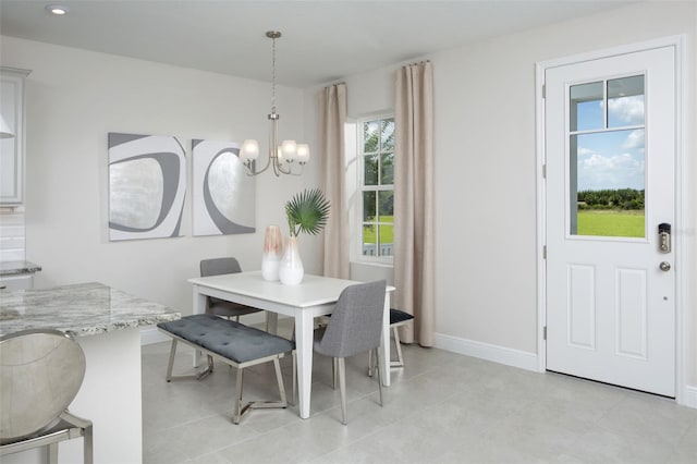 2380 Celebration Blvd, Celebration, FL 34747 - dining space featuring a chandelier and baseboards