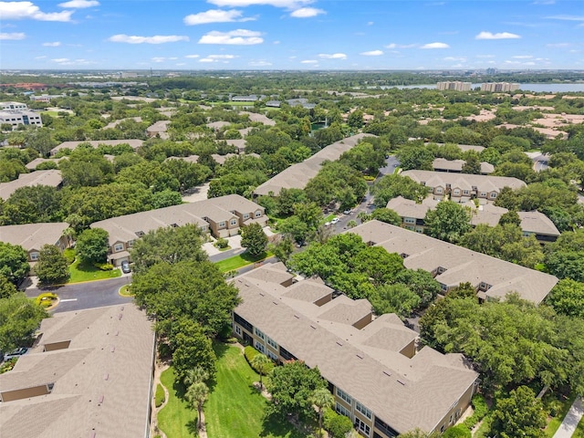 6453 Alcalde Ct Unit 110, Orlando, FL 32835 - aerial perspective of suburban area featuring a large body of water and a tree filled landscape