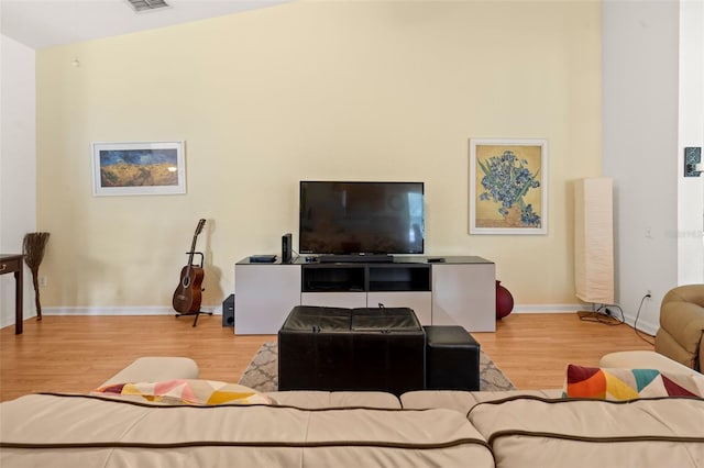 6453 Alcalde Ct Unit 110, Orlando, FL 32835 - living room featuring wood finished floors