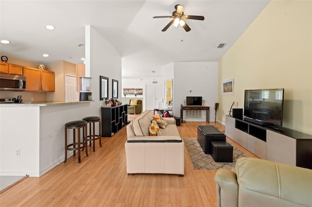6453 Alcalde Ct Unit 110, Orlando, FL 32835 - living room featuring ceiling fan, light wood-type flooring, and recessed lighting