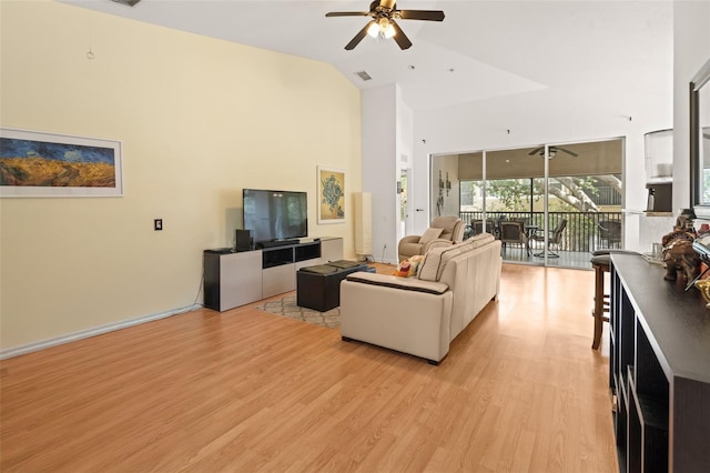 6453 Alcalde Ct Unit 110, Orlando, FL 32835 - living area featuring high vaulted ceiling, ceiling fan, and light wood-style flooring