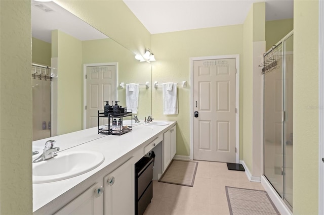 6453 Alcalde Ct Unit 110, Orlando, FL 32835 - full bathroom featuring double vanity, tile patterned floors, and a shower stall