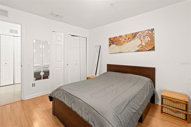 6453 Alcalde Ct Unit 110, Orlando, FL 32835 - bedroom with light wood-style flooring