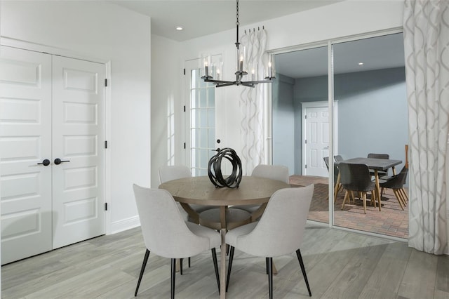 2386 Celebration Blvd, Celebration, FL 34747 - dining room featuring light wood-type flooring, a chandelier, and recessed lighting