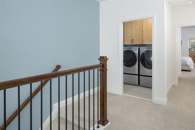 2386 Celebration Blvd, Celebration, FL 34747 - laundry area with washing machine and clothes dryer, light carpet, and cabinet space