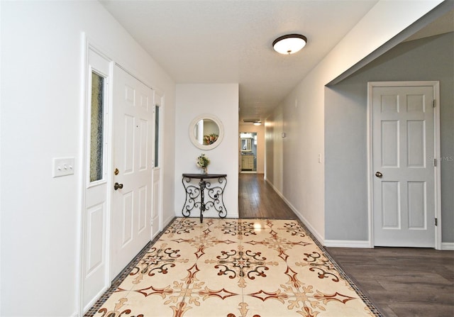 26 Canter Club Ct, Debary, FL 32713 - foyer with dark wood-style flooring and baseboards