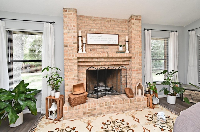 26 Canter Club Ct, Debary, FL 32713 - living room with wood finished floors and a brick fireplace