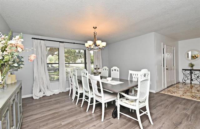 26 Canter Club Ct, Debary, FL 32713 - dining space featuring wood finished floors, a chandelier, and a textured ceiling