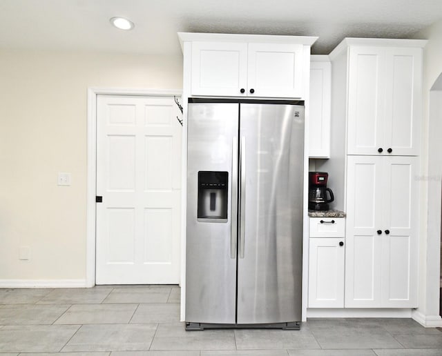 26 Canter Club Ct, Debary, FL 32713 - kitchen with stainless steel fridge, white cabinetry, and recessed lighting