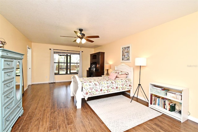 26 Canter Club Ct, Debary, FL 32713 - bedroom with wood finished floors, a textured ceiling, and a ceiling fan