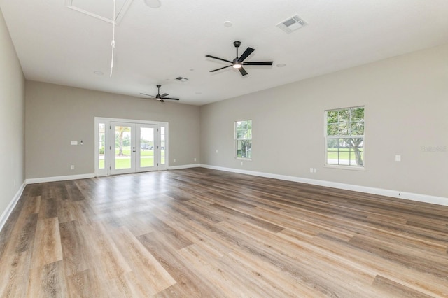 1660 Justin Matthew Way, Saint Cloud, FL 34771 - empty room featuring attic access, a ceiling fan, and wood finished floors