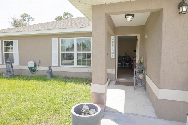 16863 SW 29th Terrace Rd, Ocala, FL 34473 - property entrance featuring a lawn, stucco siding, and a shingled roof