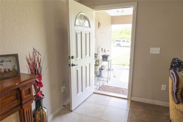 16863 SW 29th Terrace Rd, Ocala, FL 34473 - foyer featuring plenty of natural light, light tile patterned floors, and a textured wall