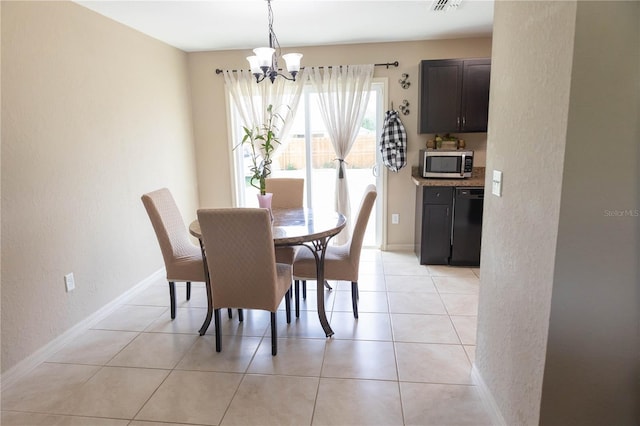 16863 SW 29th Terrace Rd, Ocala, FL 34473 - dining room with a chandelier, a textured wall, and light tile patterned floors
