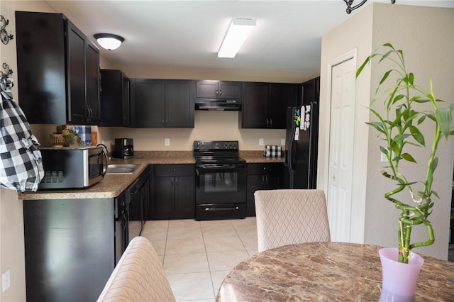 16863 SW 29th Terrace Rd, Ocala, FL 34473 - kitchen featuring black appliances, ventilation hood, light tile patterned floors, and dark cabinets