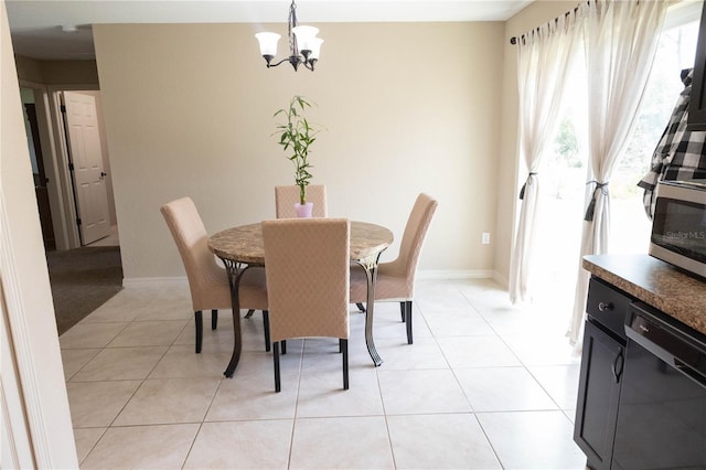 16863 SW 29th Terrace Rd, Ocala, FL 34473 - dining room with a chandelier and light tile patterned floors