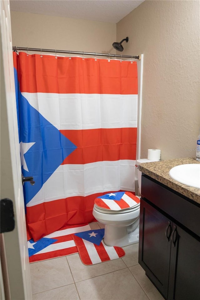 16863 SW 29th Terrace Rd, Ocala, FL 34473 - bathroom featuring vanity, curtained shower, a textured wall, and tile patterned flooring