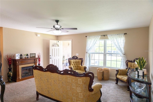 16863 SW 29th Terrace Rd, Ocala, FL 34473 - carpeted living room with ceiling fan and a glass covered fireplace