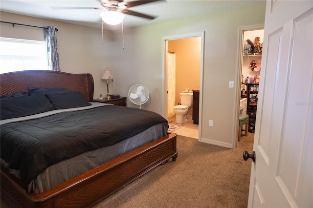 16863 SW 29th Terrace Rd, Ocala, FL 34473 - carpeted bedroom with ensuite bathroom and a ceiling fan