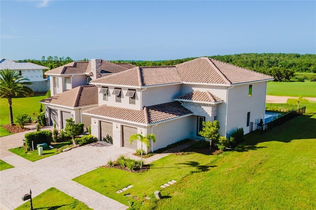 15942 Vetta Dr, Bella Collina, FL 34756 - view of front of home featuring a tile roof, driveway, stucco siding, and a front yard