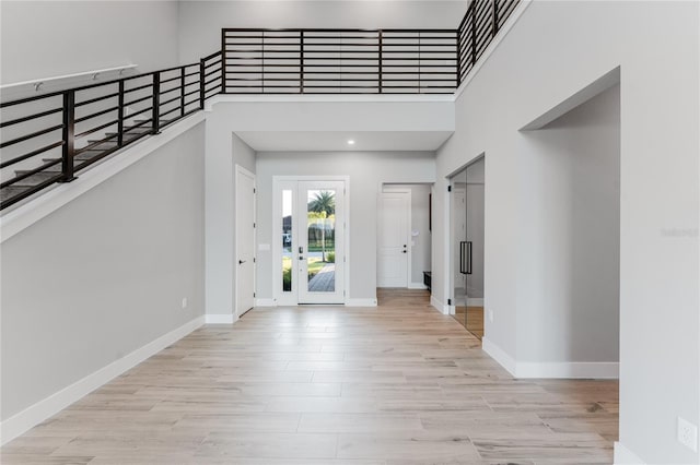 15942 Vetta Dr, Bella Collina, FL 34756 - foyer entrance featuring light wood-style floors and a towering ceiling
