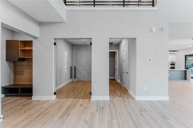 15942 Vetta Dr, Bella Collina, FL 34756 - unfurnished living room with wood finished floors and a high ceiling