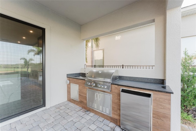 15942 Vetta Dr, Bella Collina, FL 34756 - view of patio / terrace with exterior kitchen