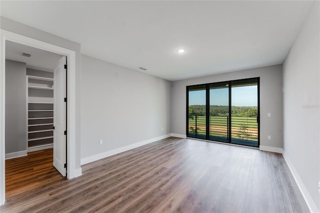 15942 Vetta Dr, Bella Collina, FL 34756 - unfurnished room with wood finished floors and recessed lighting