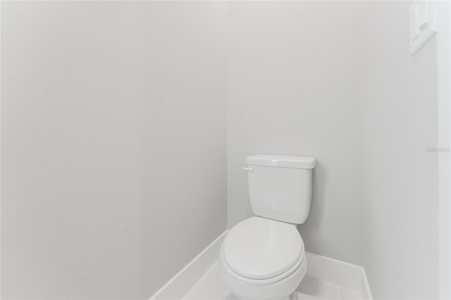 15942 Vetta Dr, Bella Collina, FL 34756 - bathroom with toilet and baseboards