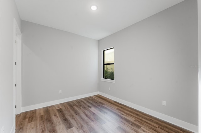 15942 Vetta Dr, Bella Collina, FL 34756 - empty room featuring baseboards and wood finished floors