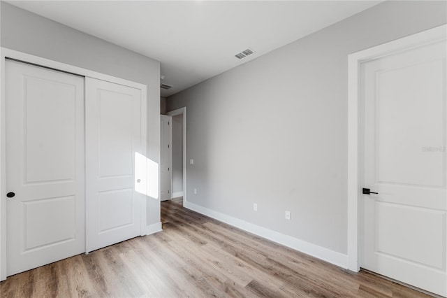 15942 Vetta Dr, Bella Collina, FL 34756 - unfurnished bedroom featuring wood finished floors and a closet