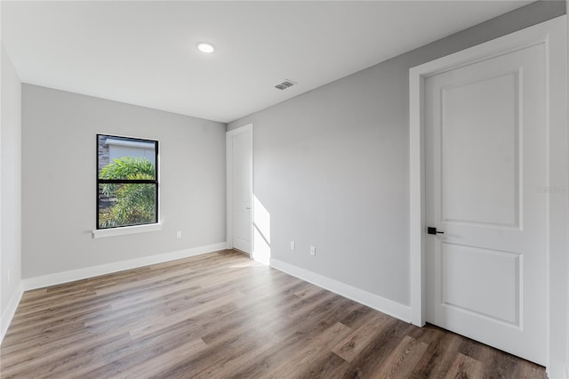 15942 Vetta Dr, Bella Collina, FL 34756 - empty room with wood finished floors and recessed lighting