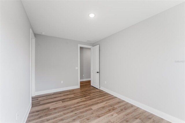 15942 Vetta Dr, Bella Collina, FL 34756 - empty room with light wood finished floors and recessed lighting