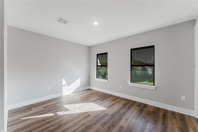 15942 Vetta Dr, Bella Collina, FL 34756 - unfurnished room featuring wood finished floors and recessed lighting