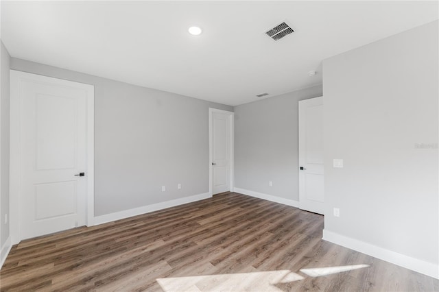 15942 Vetta Dr, Bella Collina, FL 34756 - empty room featuring wood finished floors and recessed lighting
