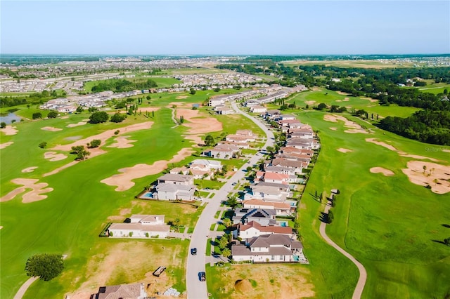 15942 Vetta Dr, Bella Collina, FL 34756 - aerial perspective of suburban area with a golf course and a tree filled landscape