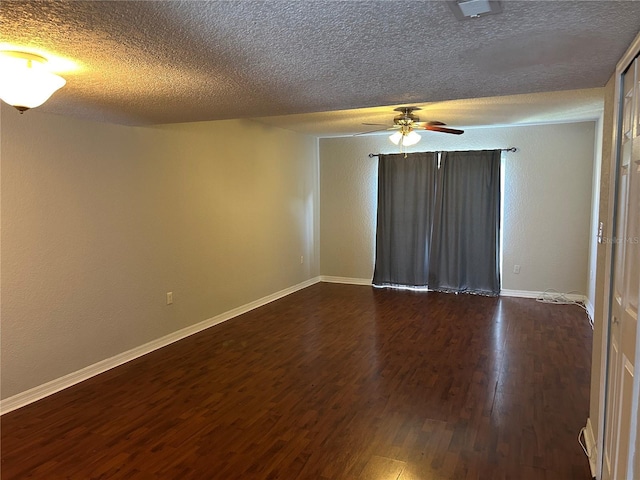 1922 Conway Rd Unit 1922, Orlando, FL 32812 - spare room with dark wood-style floors, ceiling fan, and a textured ceiling