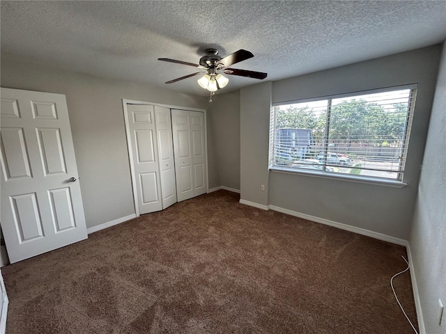 1922 Conway Rd Unit 1922, Orlando, FL 32812 - unfurnished bedroom with carpet, a textured ceiling, a closet, and a ceiling fan