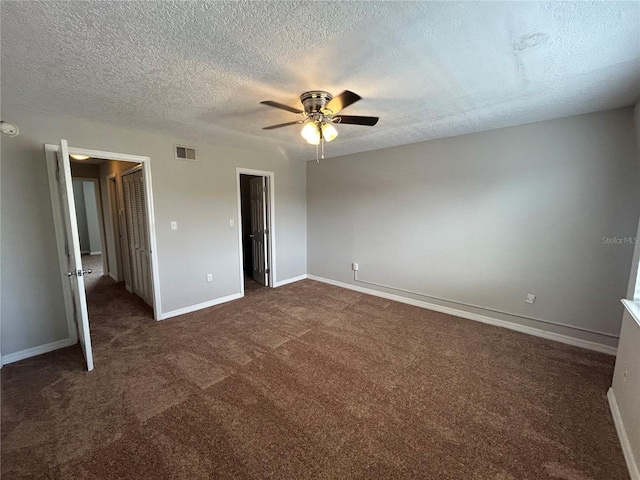 1922 Conway Rd Unit 1922, Orlando, FL 32812 - unfurnished bedroom with dark carpet, a textured ceiling, and ceiling fan