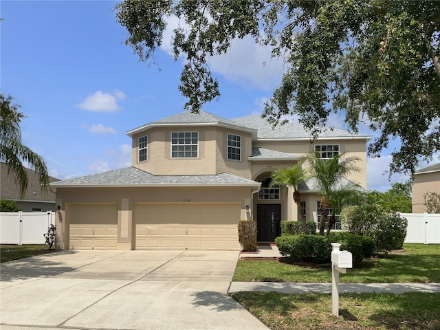 11356 Callaway Pond Dr, Riverview, FL 33579 - view of front of home featuring stucco siding, driveway, an attached garage, a gate, and a shingled roof