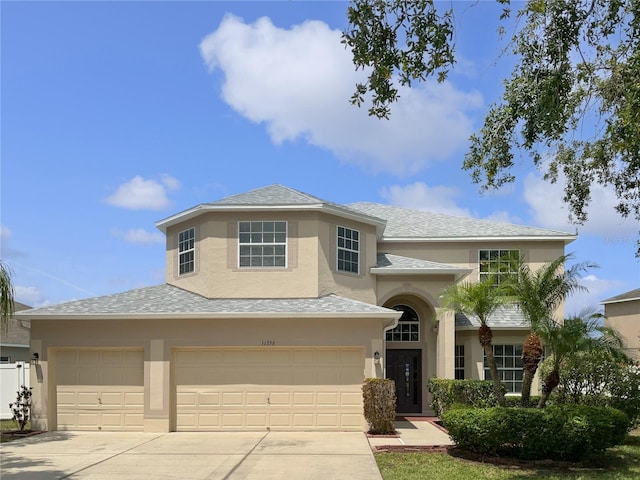 11356 Callaway Pond Dr, Riverview, FL 33579 - view of front of property with stucco siding, concrete driveway, an attached garage, and a shingled roof
