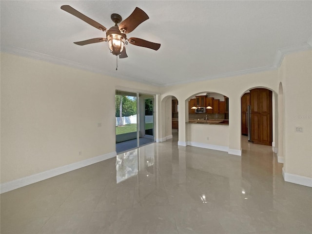 11356 Callaway Pond Dr, Riverview, FL 33579 - empty room featuring crown molding, ceiling fan, and arched walkways