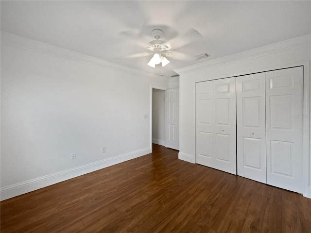 11356 Callaway Pond Dr, Riverview, FL 33579 - unfurnished bedroom with crown molding, dark wood-style flooring, a closet, and ceiling fan